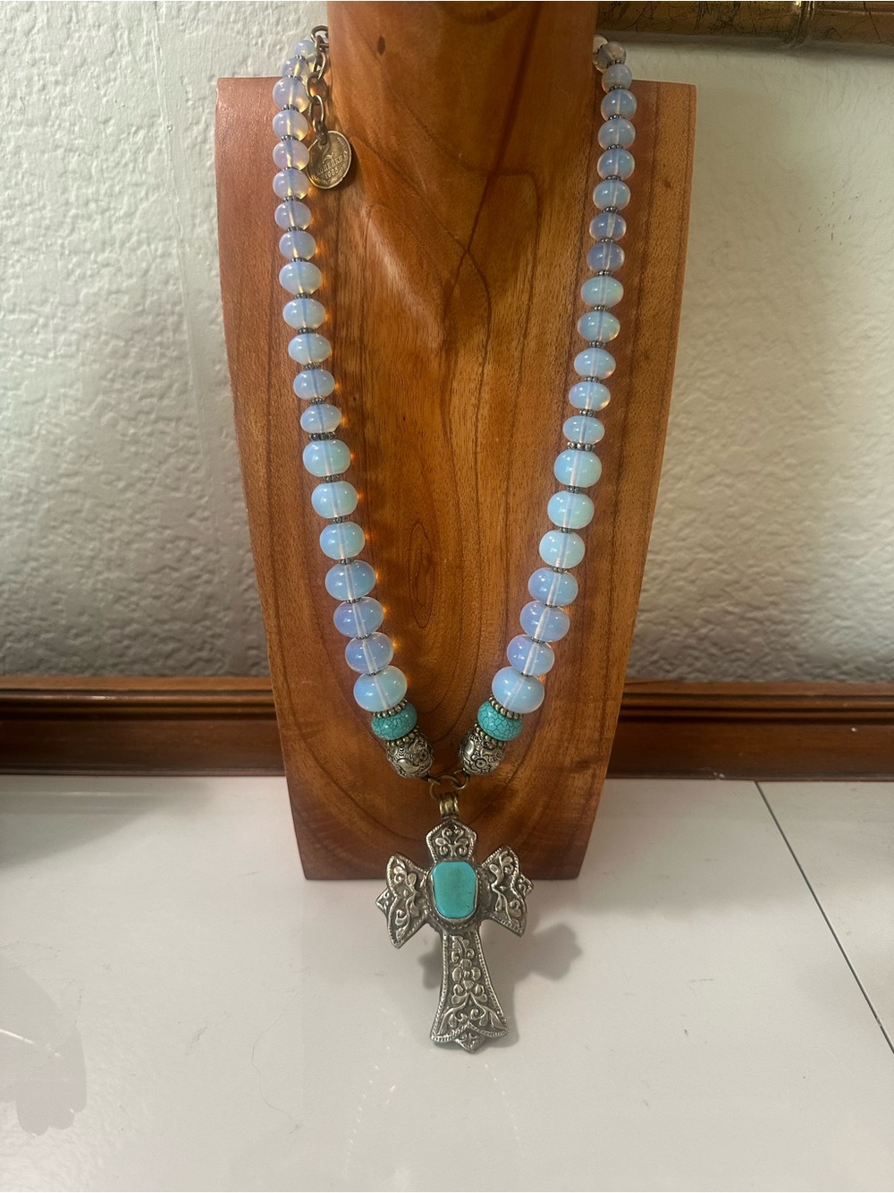 Masha Archer opalite glass turquoise accents silver tone cross necklace